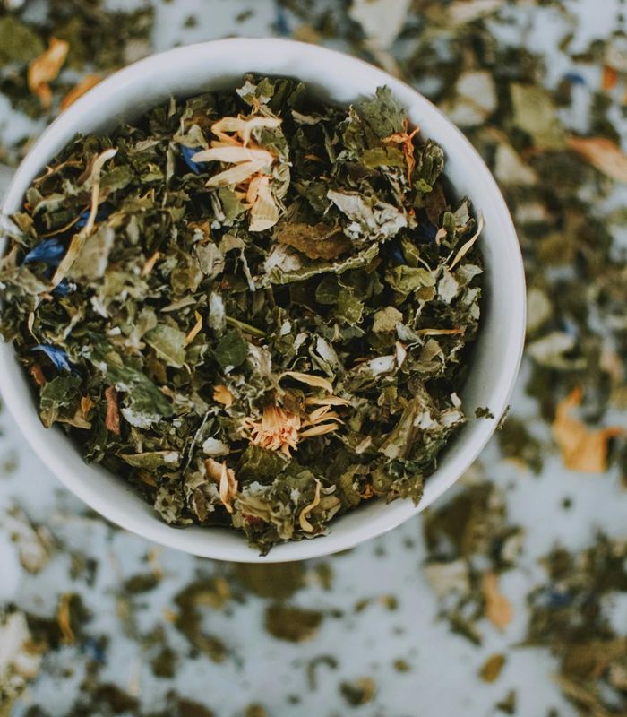 Natural herbal wellness composition with green leaves and clarity